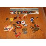 A collection of Czech and other gilt metal and enamel decorated lapel badges, etc