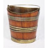 A 19th Century mahogany and brass bound peat bucket with brass liner and swing handle, 14" high