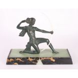 An Art Deco bronzed figure of Diana on marble and onyx base, 10" high