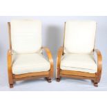 A pair of 1930s bentwood open armchairs with loose back and seat cushions