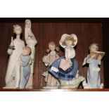 Four Lladro figures of children and a similar Nao figure