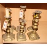 Three pairs of 18th and 19th Century brass candlesticks