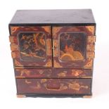 A Japanese lacquered table cabinet