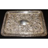 A rectangular repoussé decorated silver dressing table tray, 11 1/2" x 8", 11.5oz troy approx