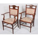 A pair of Edwardian mahogany and satinwood banded and inlaid open armchairs, back and seat panels