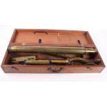 A 19th Century three-draw brass table telescope on adjustable base, in fitted mahogany case