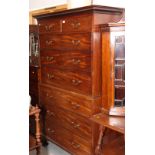 A George III mahogany tall boy with dentil cornice, fitted two short and six long drawers with brass