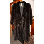 A full length mink coat by Saga Mink labelled Jindo at Dickens & Jones