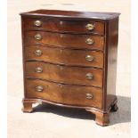 A George III mahogany serpentine front chest of five long graduated drawers with canted corners,