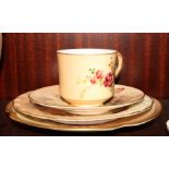 A Royal Worcester floral decorated cup and saucer and two similar Worcester plates