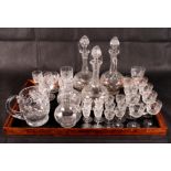 A selection of cut glass and crystal to include a claret jug, decanters, a water jug and drinking