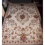 A floral tapestry rug on ivory ground, 74" x 54" approx