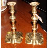 A pair of mid 18th Century metal base candlesticks, 8" high