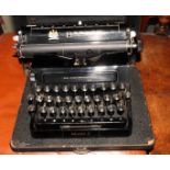 A Bar-Let portable typewriter with three rows of keys