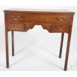 A 19th Century oak lowboy, fitted one shallow and two small drawers, on square supports, 32" wide