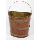 A 19th Century mahogany and brass bound peat bucket with brass liner, 13" high