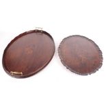 A 19th Century carved mahogany oval tray with pie crust edge, 22" dia, and an Edwardian two-