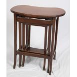 A nest of three mahogany kidney-shaped tables, on splayed supports