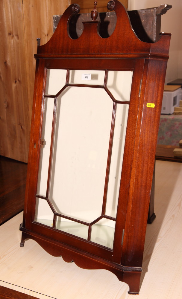 A polished as mahogany display cabinet enclosed lattice glazed doors