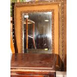 A gilt velvet framed wall mirror with bevelled plate, 17 1/2" x 11"