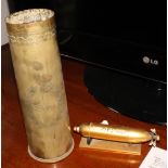 A brass trench art shell case engraved "Northumberland Volunteers" and a brass torpedo desk