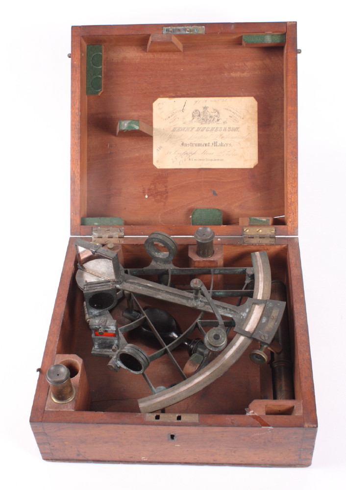 A brass sextant by Henry Hughes & Sons, in fitted mahogany case