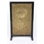 An early 20th Century embossed and engraved brass panel, "Sherazade", now converted as a firescreen,
