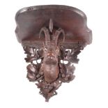 A 19th Century Black Forest carved wood wall bracket with deer and oak design, 14" high