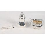 A silver milk jug, a silver dredger and a pair of sugar tongs, 10.3oz troy approx