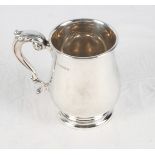 A George III design silver tankard with baluster body engraved initials and broken scroll handle,