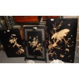 A 19th Century Japanese black lacquer panel inset carved ivory and bone figure of an eagle on a