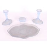 A pair of blue frosted glass candlesticks, a matching tray and a trinket box