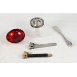 Two table cigar cutters, a silver handled shoehorn, a glass preserve jar with silver top and a