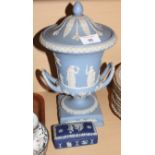 A Wedgwood blue jasperware two-handled campana vase and cover on square base and a Wedgwood