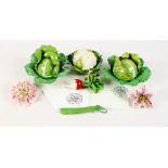 Three ceramic boxes in the form of a cauliflower and cabbage, two similar flowers, a radish and a