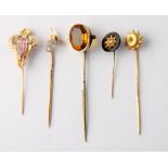 A 15ct gold stick pin and four other stick pins, various