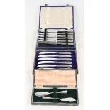 Two cased sets of silver-handled dessert knives and a cased pair of silver butter knives
