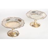 A pair of silver pedestal tazza with shaped and pierced scrolled borders, 26.5oz troy approx