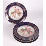 A set of six continental porcelain cabinet plates decorated central figures and blue and gilt