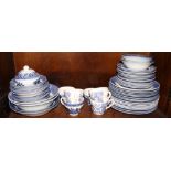 A matched set of Willow pattern dinnerware