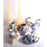 A Cantigali blue pottery inkwell, two obelisks, a pair of Beswick seated spaniels and other items of
