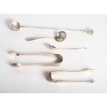 A white metal sundae spoon, a Russian silver teaspoon, a silver sifter spoon and two pairs of silver