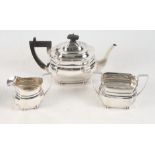 A silver three-piece melon-shaped teaset with ebonised handle and knop, 30.2oz troy approx