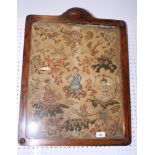 A 19th Century embroidered petit point panel worked kneeling Chinese figures, birds and flowers, 20"