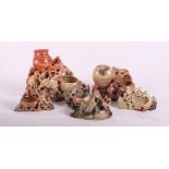 Three Chinese carved soapstone brush washers with monkeys and three smaller similar with floral