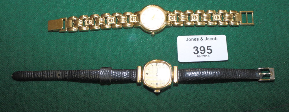 A lady's Raymond Weil 18ct gold plated wristwatch with champagne crystal dial and a lady's Camy