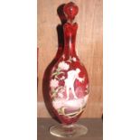 A 19th Century ruby glass decanter jug and stopper with "Mary Gregory" decoration of flowers and