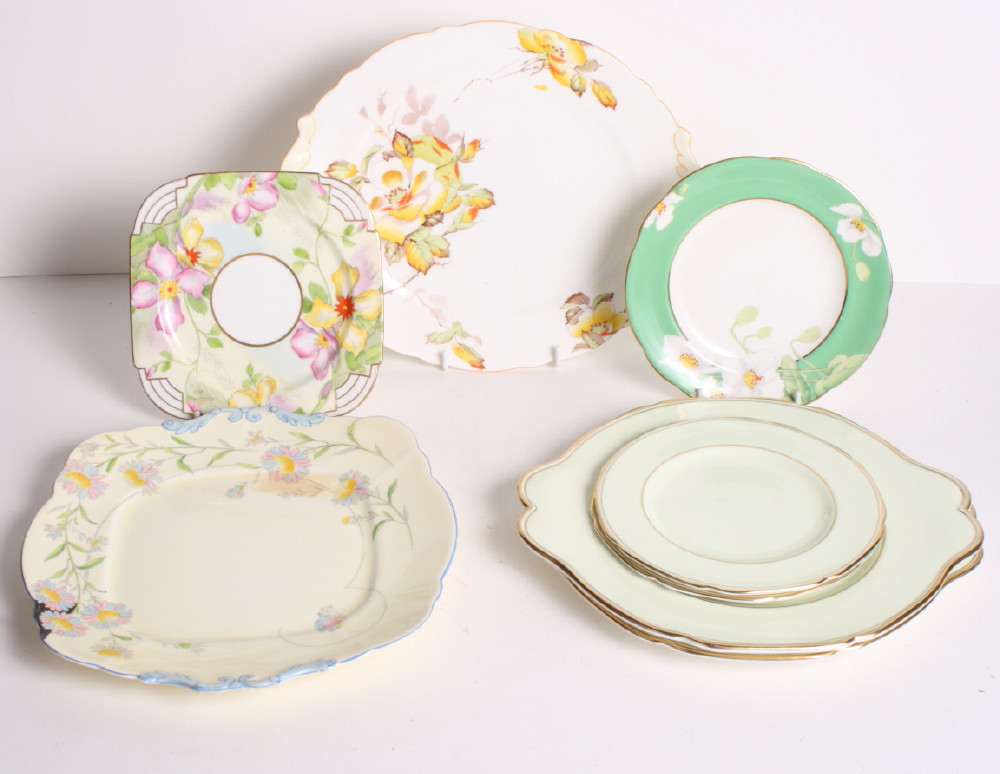 Eight 1930s Paragon floral decorated cake plates, an Art Deco shaped plate and a similar tea plate