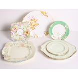 Eight 1930s Paragon floral decorated cake plates, an Art Deco shaped plate and a similar tea plate
