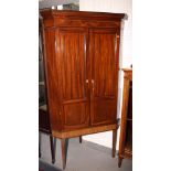 A George III mahogany corner cupboard, fitted three shaped front shelves enclosed two twin